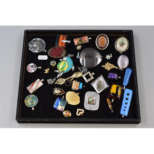 81 - A Selection of Various Designer Pendants To Include Mother of Pearl, Beetle, Dolphin, And More