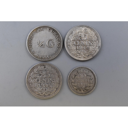 142 - Four Netherlands Silver Coins. Includes Two 25 Cents (1928 and 1944), 1921 10 Cents, And 1944 1/4 Gu... 