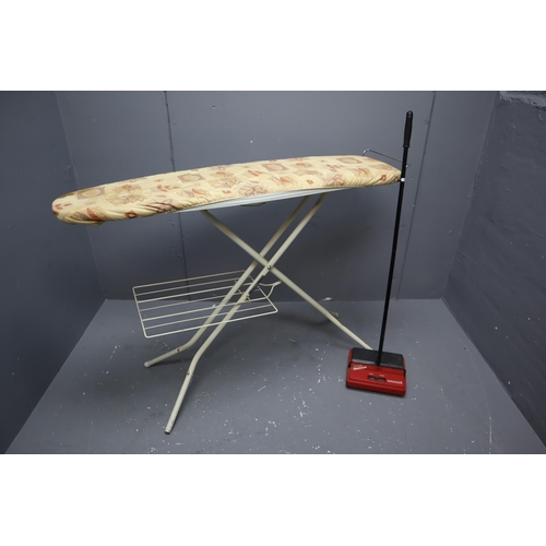 574 - Bissell easy sweep and ironing board & maiden