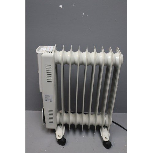 724 - Small electric radiator in grey, 21