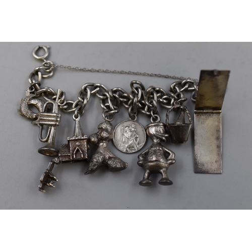 39 - Sterling Silver Bracelet Containing Containing 8 Charms