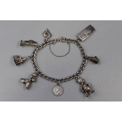 39 - Sterling Silver Bracelet Containing Containing 8 Charms