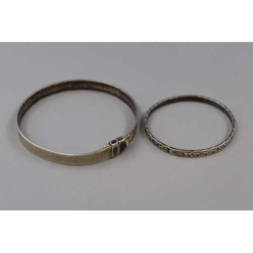 42 - Two Small Marked Silver Bangles