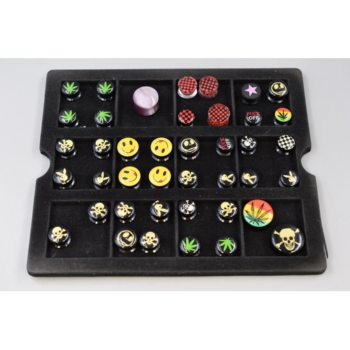 113 - Selection of Various Large Sized Ear Stretching Piercings. Pirate, Playboy, Marajuana, And Others