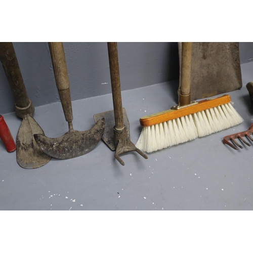 638 - A Selection of Eleven Gardening Tools To Include Garden Fork, Spades, Rakes, Brushes, And More