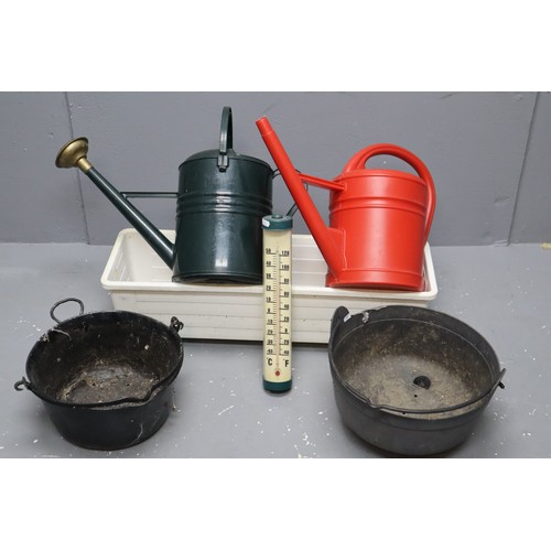 435 - Three garden planters & two plastic watering cans and an outdoor thermometer