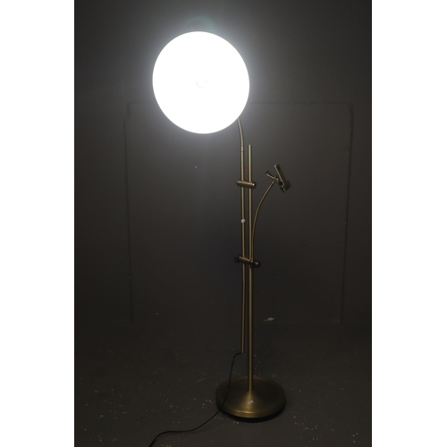 438 - A Large Adjustable Brushed Metal Floor Lamp With Clamp, Lights Up When Tested