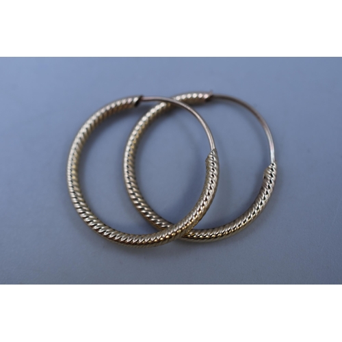 13 - Pair of 375 Gold Hooped Earrings