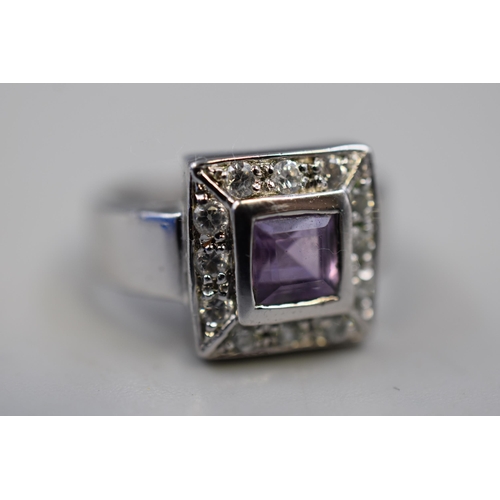 60 - A 925. Silver Clear and Purple Stoned Ring, Size M