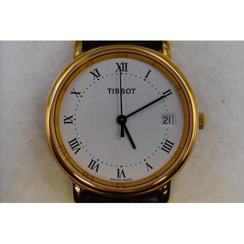 99 - A Tissot Gold Tone Quartz Day/Time Watch, Working. Presentation Box Not Original