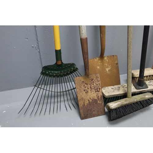 575 - A Selection of Eight Gardening Tools To Include Mostly Brushes, Spades and A Rake