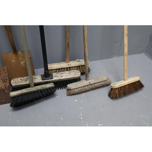 575 - A Selection of Eight Gardening Tools To Include Mostly Brushes, Spades and A Rake