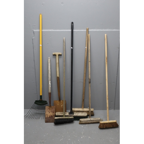 575 - A Selection of Eight Gardening Tools To Include Mostly Brushes, Spades and A Rake