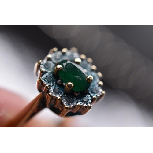 26 - Gold 375 0.05 Diamond and Green Stoned Ring