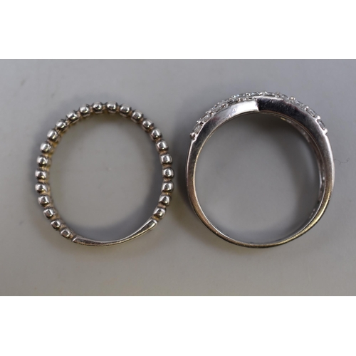 67 - Two 925 Silver Rings To Include Clear Stoned Cross, And Other