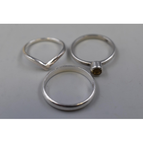 75 - Three 925. Silver Rings To Include Wishbone Ring, Band Ring, And Other