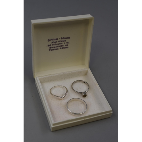 75 - Three 925. Silver Rings To Include Wishbone Ring, Band Ring, And Other