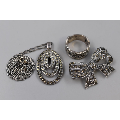 94 - Three Pieces of 925. Silver Marcasite Jewellery To Include Ring (Size P), Bow Brooch, And Pendant Ne... 