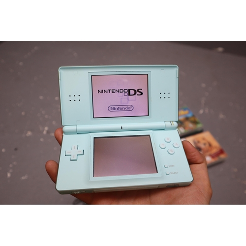 521 - Nintendo DS Lite Turquoise Colour With Charger and Six Games Also Comes With Big Ben Case, Pen, Head... 