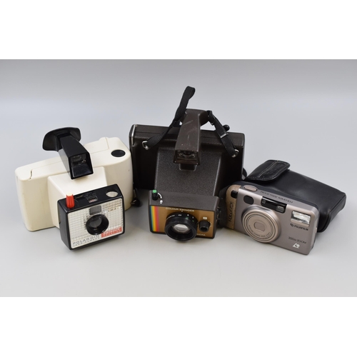 528 - Three Cameras to Include Polaroid, Fujifilm and Polaroid Land Camera