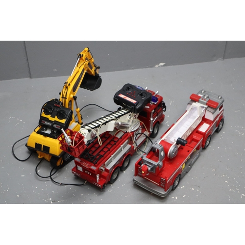 529 - Two large fire trucks, one remote control (working when tested, slight wobbly front wheel) and a pus... 