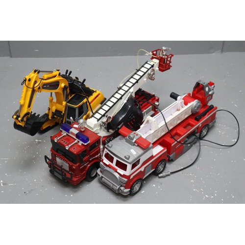 529 - Two large fire trucks, one remote control (working when tested, slight wobbly front wheel) and a pus... 