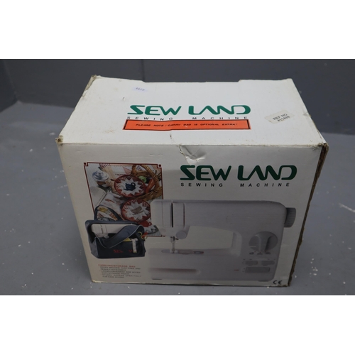 550 - Boxed Sew Land Sewing machine Complete with power lead working when tested