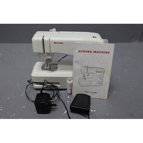 550 - Boxed Sew Land Sewing machine Complete with power lead working when tested