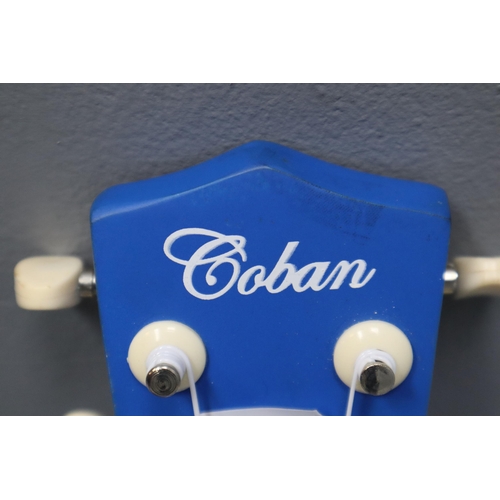 554 - Coban Guitars Blue Ukulele Complete in Coban Carry Case