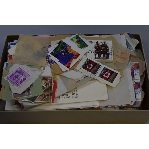 460 - A Selection of Unsorted Mounted Worldwide Stamps