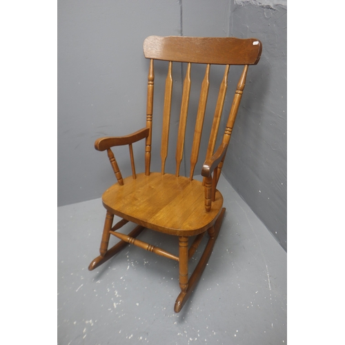 598 - Kitchen pine armchair rocker 39 high x 21 wide x 29 deep.