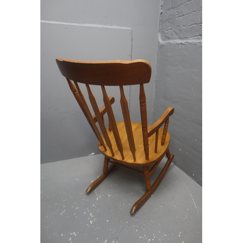 598 - Kitchen pine armchair rocker 39 high x 21 wide x 29 deep.