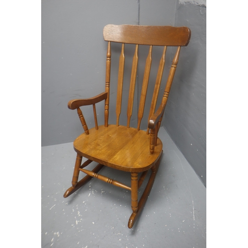 598 - Kitchen pine armchair rocker 39 high x 21 wide x 29 deep.