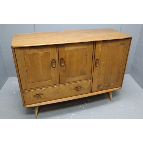 480 - Ercol (Lucian Ercolani) model 366 Windsor elm sideboard, fitted with a double door cupboard, a singl... 