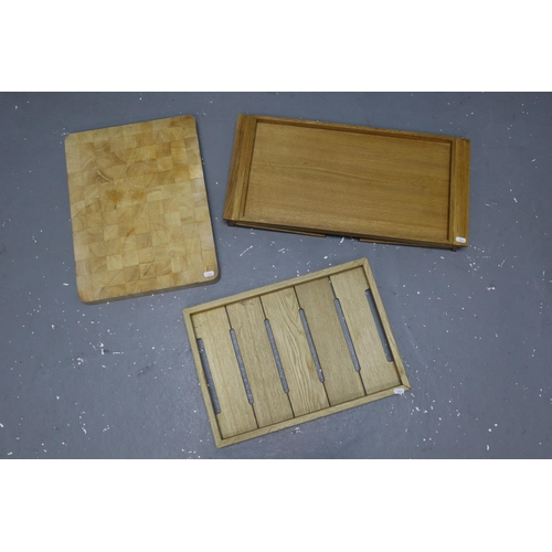 914 - One wooden tray, one thick heavy chopping board and one wooden dinner tray