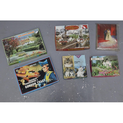 916 - Selection of Jigsaw Puzzles to Include Cats, Cottage Garden, Royal Wedding, Thunderbirds, Steam Engi... 