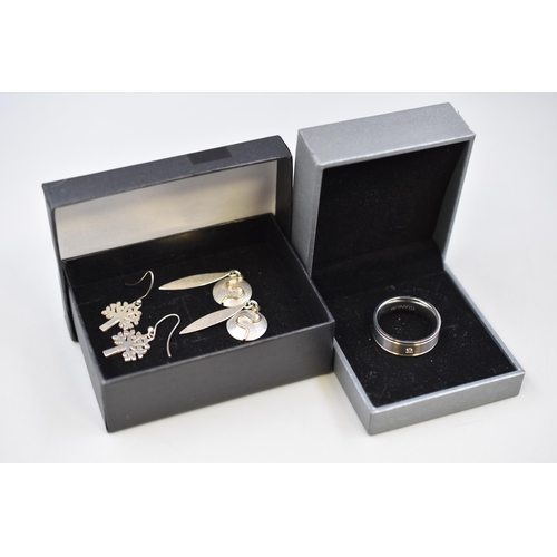 79 - Two Boxed Jewellery Items to include Two Sets of Earrings one marked Silver 925 and a Boxed Titanium... 