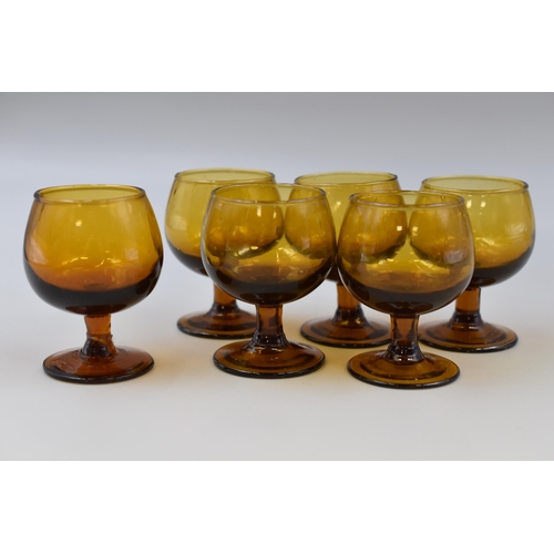 297 - A Mid Century Amber Glass Cognac Glass Set, On Wooden Stand