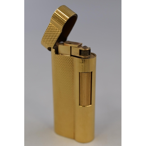 310 - A Dunhill Gold Plated Lighter (C42402), Sparks