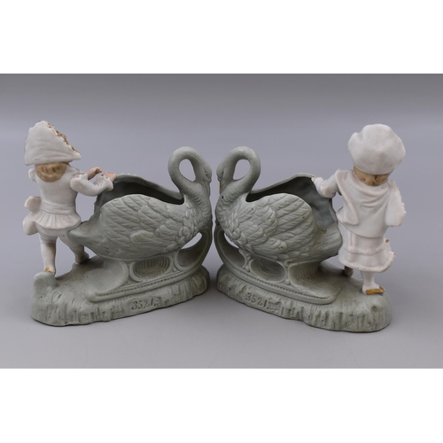 348 - A pair of Germn Bisqueware boy and girl with swans figurines 5