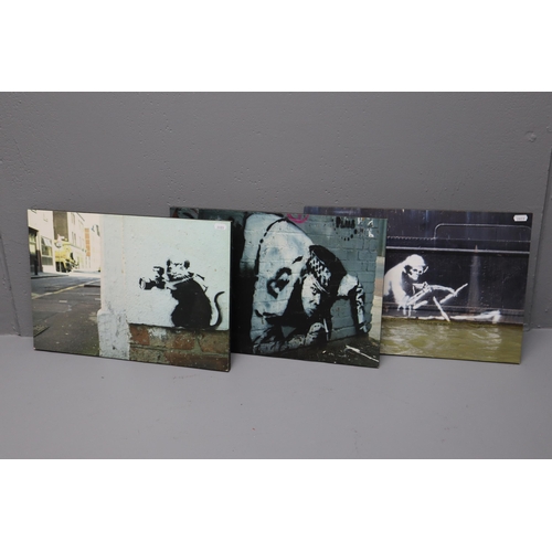 453 - Three Banksy Prints on Wooden Base to include Media Rat, Sniff Snorting Cop and Grim Reaper approx 1... 