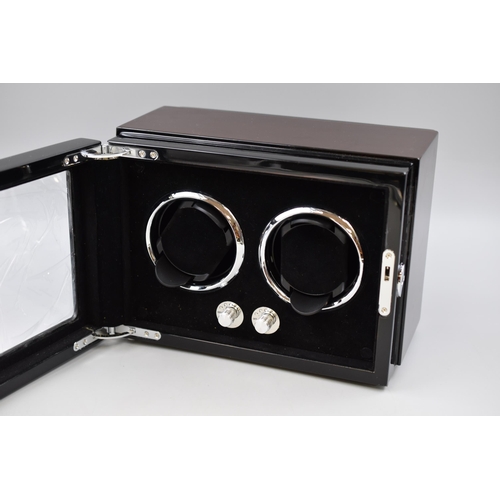 561 - A Dukwin Black and Wood Effect Automatic Watch Winder, Appears New. Powers On When Tested, Power Cab... 