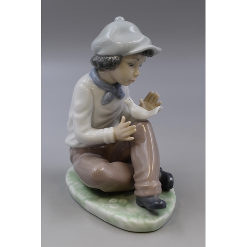 367 - Nao By Lladro Porcelain Figurine of Boy with Cap Seated with Dove (1990)