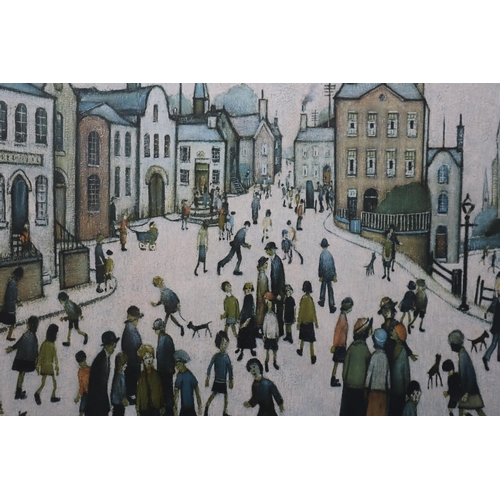 493 - A Framed and Glazed LS Lowry Print Titled 'A Village Square', Approx 27