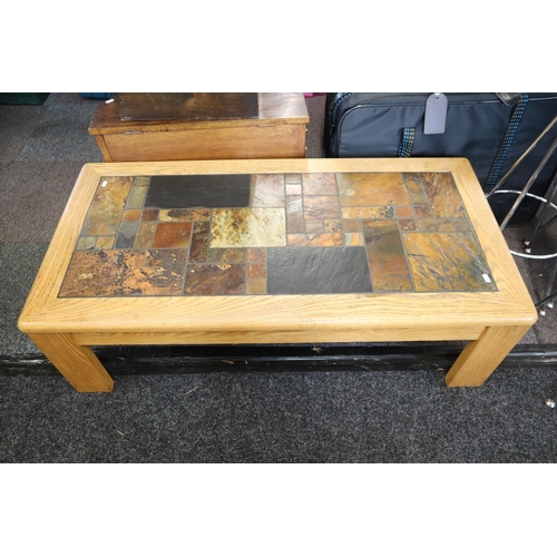 717 - Light wood tile top heavy coffee table measures 14