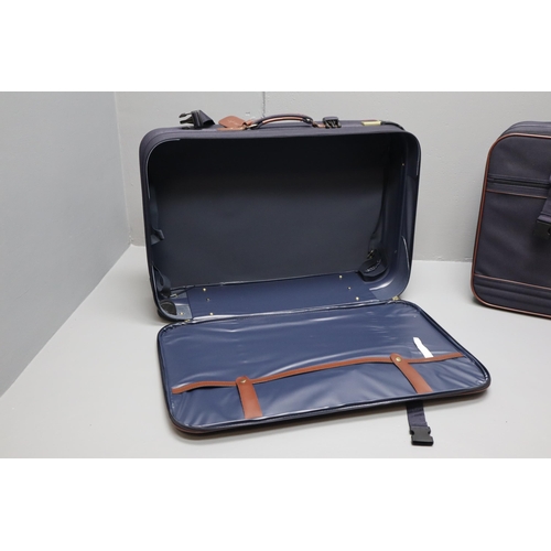 727 - Two Mario Polo suit cases in blue and brown and a small brown leather carry on case