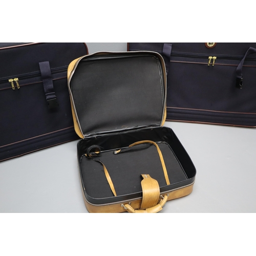 727 - Two Mario Polo suit cases in blue and brown and a small brown leather carry on case