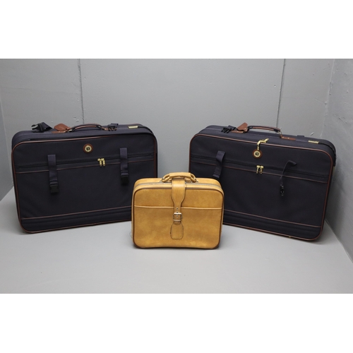 727 - Two Mario Polo suit cases in blue and brown and a small brown leather carry on case