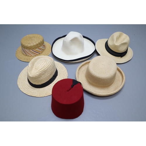 821 - Box of 5 hats plus a vintage fez in vintage British home stores hat box