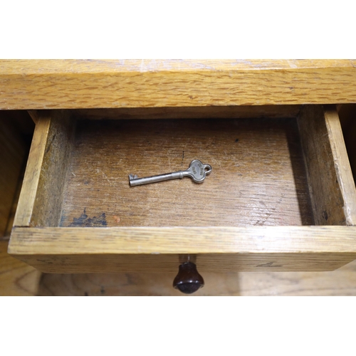 683 - Light wood writing desk, lockable with key) with drawer and storage space on castors measures 42